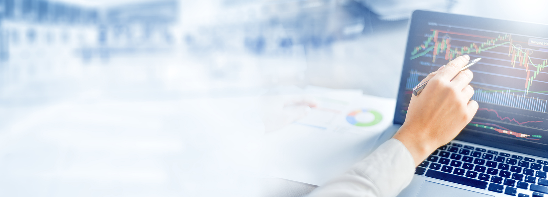 Person analyzing financial trading chart on laptop, Finance & Accounting | DXC Technology 