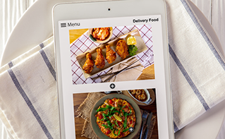 Chinese food delivery menu on cell phone screen and white & blue striped napkin, Yum China | DXC Technology Customer Story